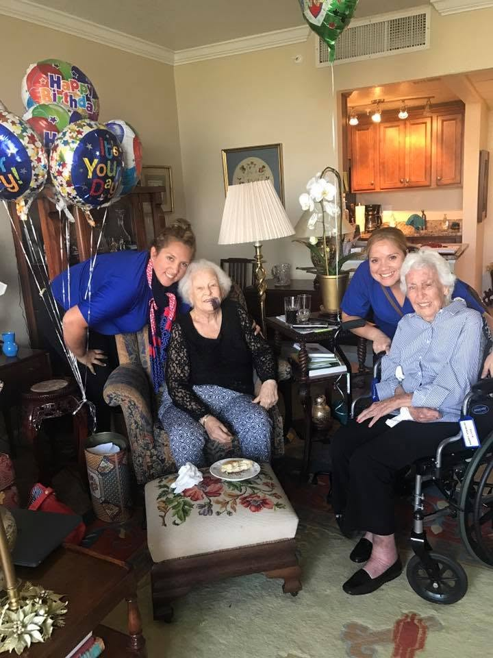 Caregivers spending time with clients at home